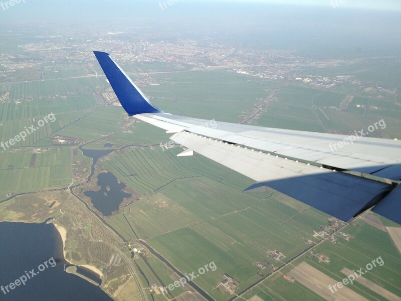 Aircraft Landing Amsterdam Wing Free Photos