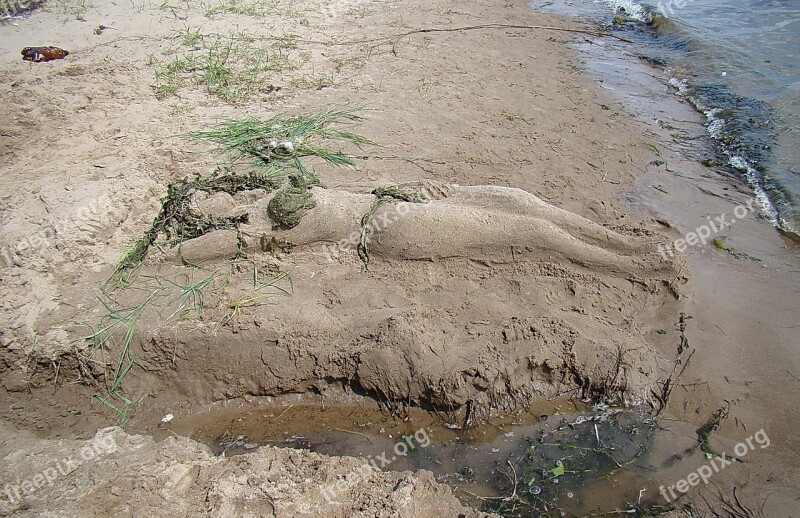 Sculpture From Sand River Bank Summer Sun