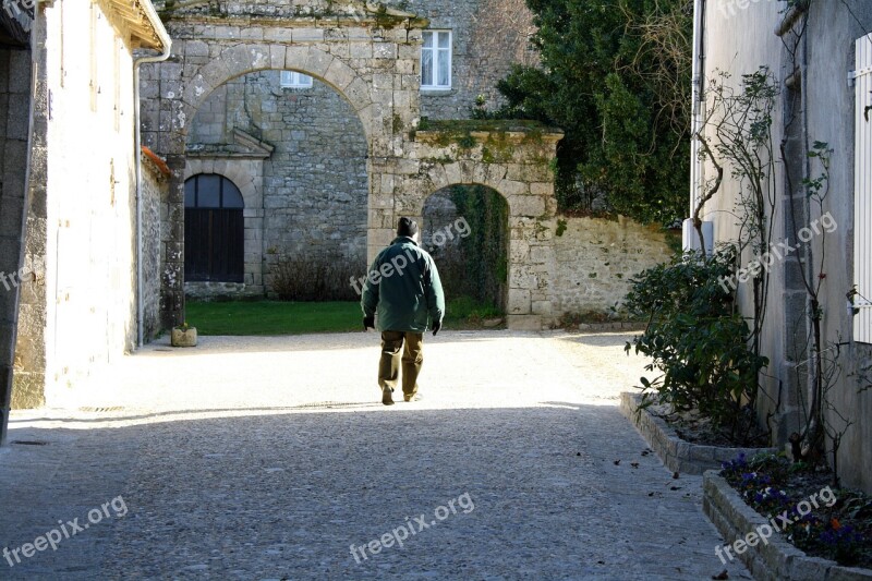 Man Walking Alley Man Between Houses Man In Sunlight