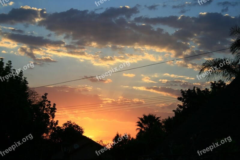 Sunset Glowing Orange Yellow Clouds