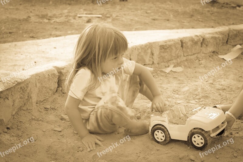 Blonde Child Linda Playing Cart Playing In The Sand