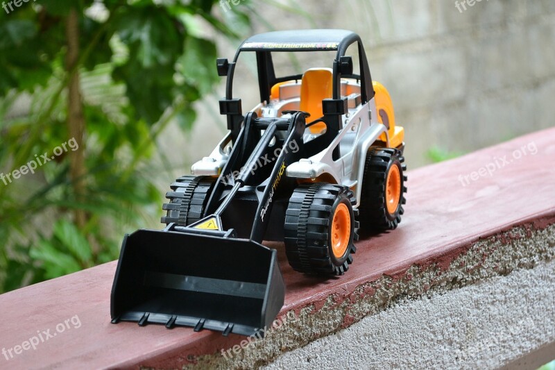 Toy Plastic Dozer Backhoe Close-up